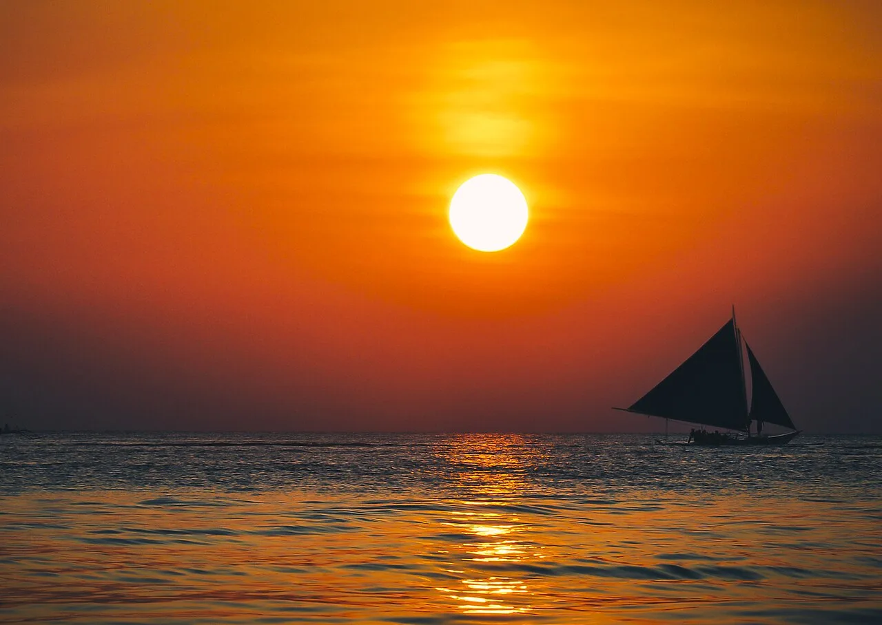 Paraw sailing boat at sunset, Philippines